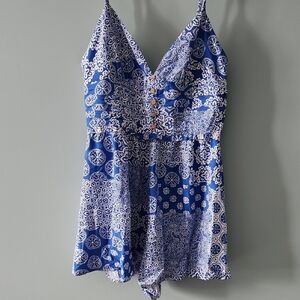 Blue and White One Piece with Plunging V-Neckline and Intricate Pattern